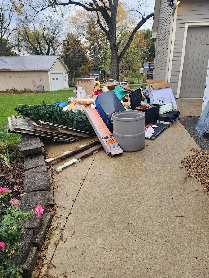 Dumpster being loaded with debris for Residential Dumpster Rental in Westminster